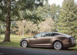 Tesla Full wrap in a custom satin valyrian gold metallic vinyl